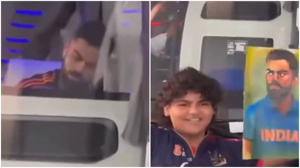 Virat Kohli signs a fan's poster Virat Kohli signs a fan's poster