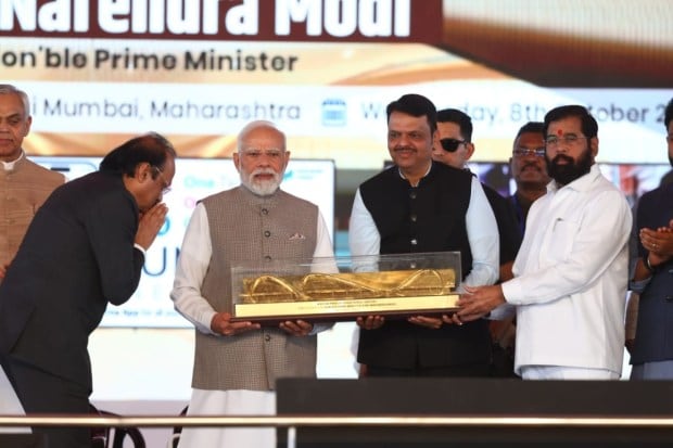 Prime Minister Narendra Modi inaugurates the Navi Mumbai International Airport with Devendra Fadnavis and Eknath Shinde . (Express photo)