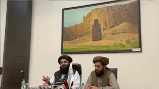 The painting of Bamiyan Buddha statues behind Afghan Minister during a press conference has gone viral on social media, with many terming the moment as a “great irnoy”.