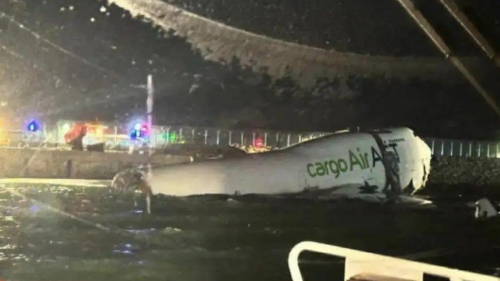 Two dead as cargo plane skids off runway into sea at Hong Kong airport