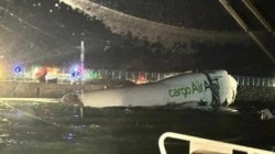 Two dead as cargo plane skids off runway into sea at Hong Kong airport