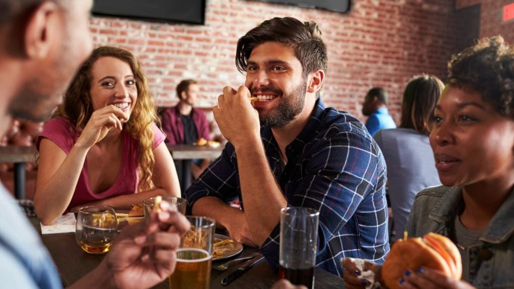 The communal dining trend which once took over the 2010s, seems to be making a resurgence with Gen Zs. (Image source: Canva)