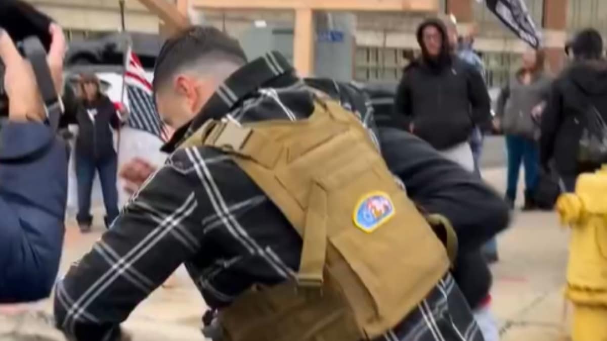 Lang, a participant in the January 6, 2021, Capitol riot, arrived on Michigan Avenue and attempted to set the holy book ablaze using a lighter. (Image source: X)