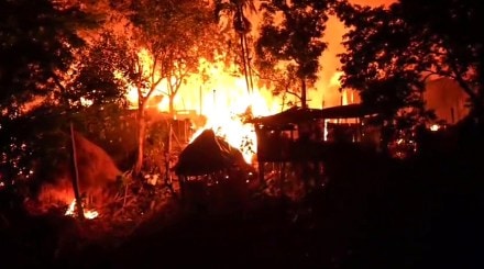 Flames billow out from an area following violent protests in Karbi Anglong on Tuesday. (ANI Video Grab) Flames billow out from an area following violent protests in Karbi Anglong on Tuesday. (ANI Video Grab)