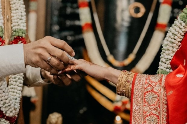To new beginnings: Samantha posted a series of pictures which captured important details of the ceremony. Here, the exchange of rings can be seen - take a look at the actress's dazzling bridal jewellery. (Image source: Samantha Ruth Prabhu/Instagram)