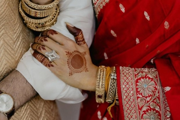 Samantha Ruth Prabhu flaunted her giant wedding ring as she carefully held on to Raj Nidimoru. Fans were also able to see details of her intricate mehndi designs as well as the details of her gorgeous saree and jewellery. (Image source: Samantha Ruth Prabhu/Instagram)