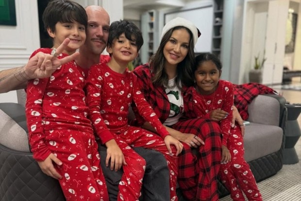 Actress Sunny Leone spent a lowkey Christmas with her family. Dressed in red jumpers, she matched the vibe with a plaid attire. (Image: Instagram)