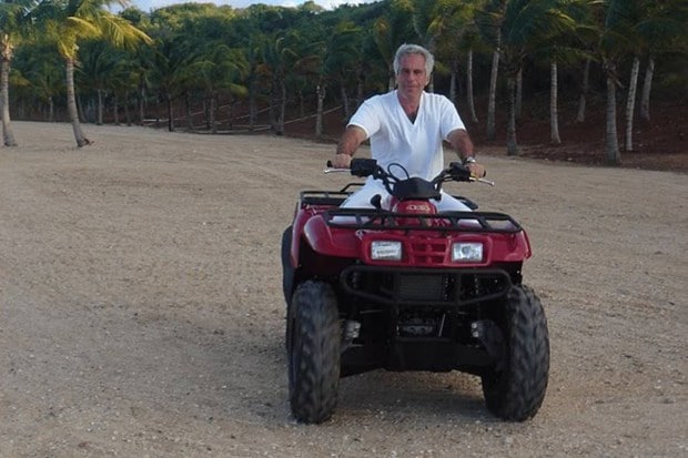 Epstein is seen riding an ATV on a beach in one of the released images. (Photo source: DOJ)