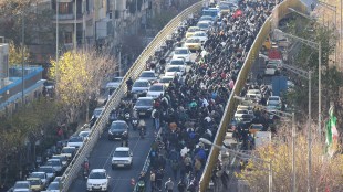 Protesters march through downtown Tehran on Monday (Photo: AP)