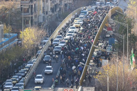 Protesters march through downtown Tehran on Monday (Photo: AP)