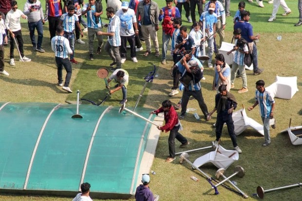 Fans damage property at the Salt Lake Stadium amid chaos and allegations of poor organisation during Argentine football star Lionel Messi’s GOAT India Tour 2025 event in Kolkata. (Image: ANI)