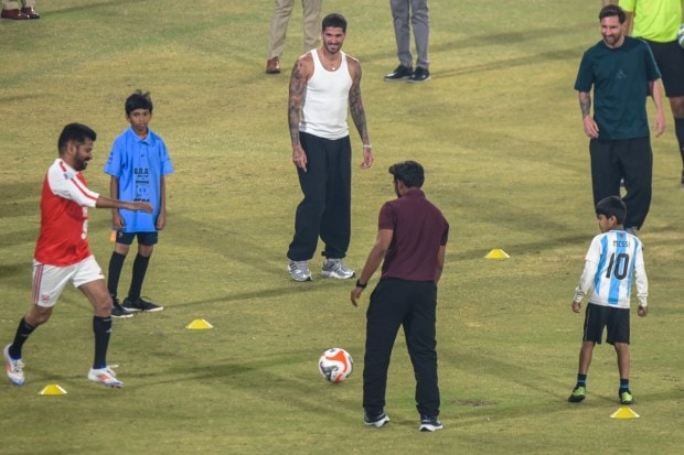 Telangana Chief Minister Revanth Reddy joins Argentine football icon Lionel Messi and Inter Miami teammates Rodrigo De Paul and Luis Suárez for a light football session during an event held as part of the second leg of the GOAT India Tour 2025 in Hyderabad. (Image: PTI)