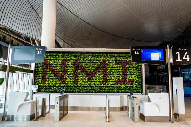 An interior view of the newly built Navi Mumbai International Airport (NMIA) featuring “NMI” written from plants. (Image source: PTI)