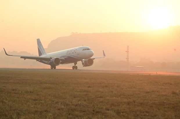 An aircraft is accorded a ceremonial water cannon salute as Navi Mumbai International Airport commences commercial flight operations. (Image source: PTI)