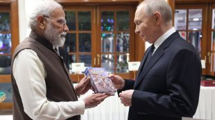 Prime Minister Narendra Modi presents a Russian-language copy of the Bhagavad Gita to President Vladimir Putin during their meeting in Delhi