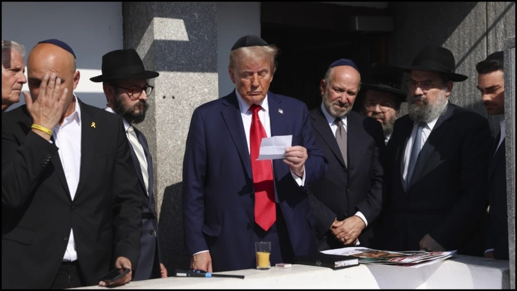 Donald Trump, center, visits the gravesite of Rabbi Menachem Mendel Schneerson at Ohel Chabad-Lubavitch, Monday, Oct. 7, 2024, in New York Donald Trump, center, visits the gravesite of Rabbi Menachem Mendel Schneerson at Ohel Chabad-Lubavitch, Monday, Oct. 7, 2024, in New York