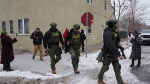 Resident accounts and videos spreading through social media suggest the agents are now conducting roving sweeps and arresting people without warrants (Photo: AP)