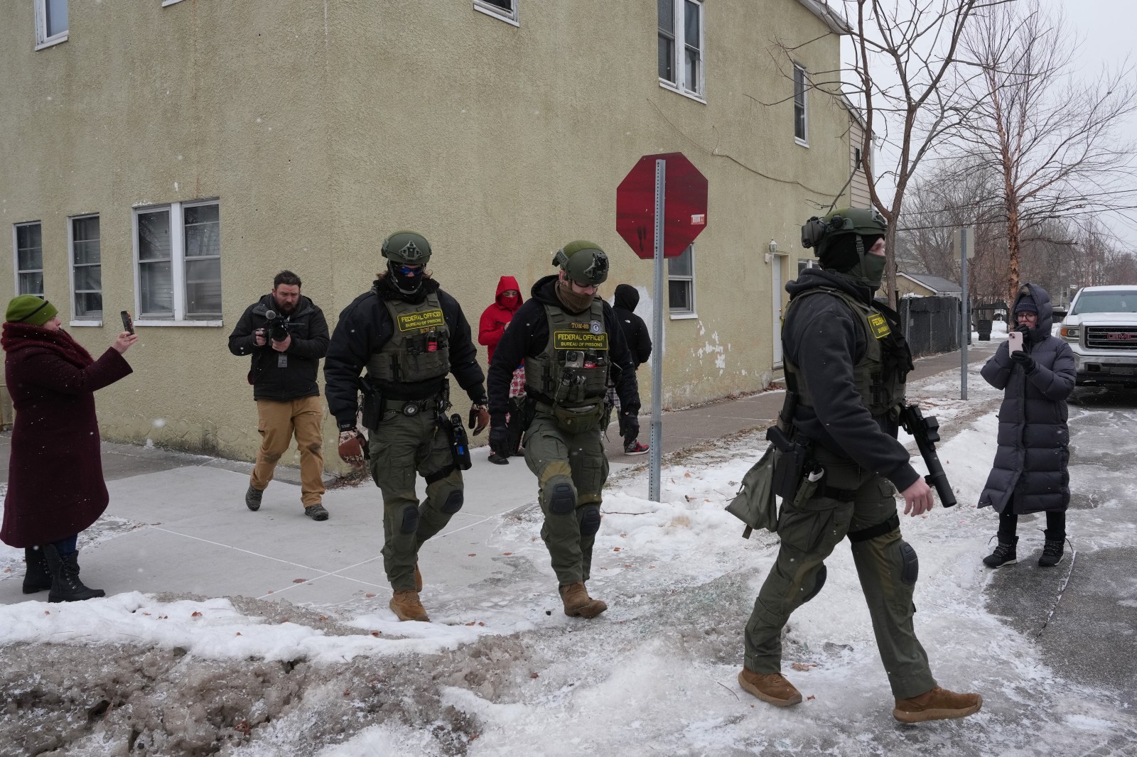 Resident accounts and videos spreading through social media suggest the agents are now conducting roving sweeps and arresting people without warrants (Photo: AP) Resident accounts and videos spreading through social media suggest the agents are now conducting roving sweeps and arresting people without warrants (Photo: AP)