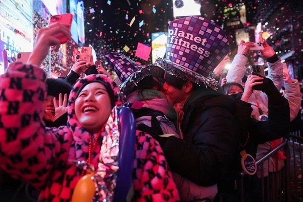  People celebrating the arrival of 2026 after the ball drop packed into the world’s most famous New York countdown spots. (Photo source: AP)