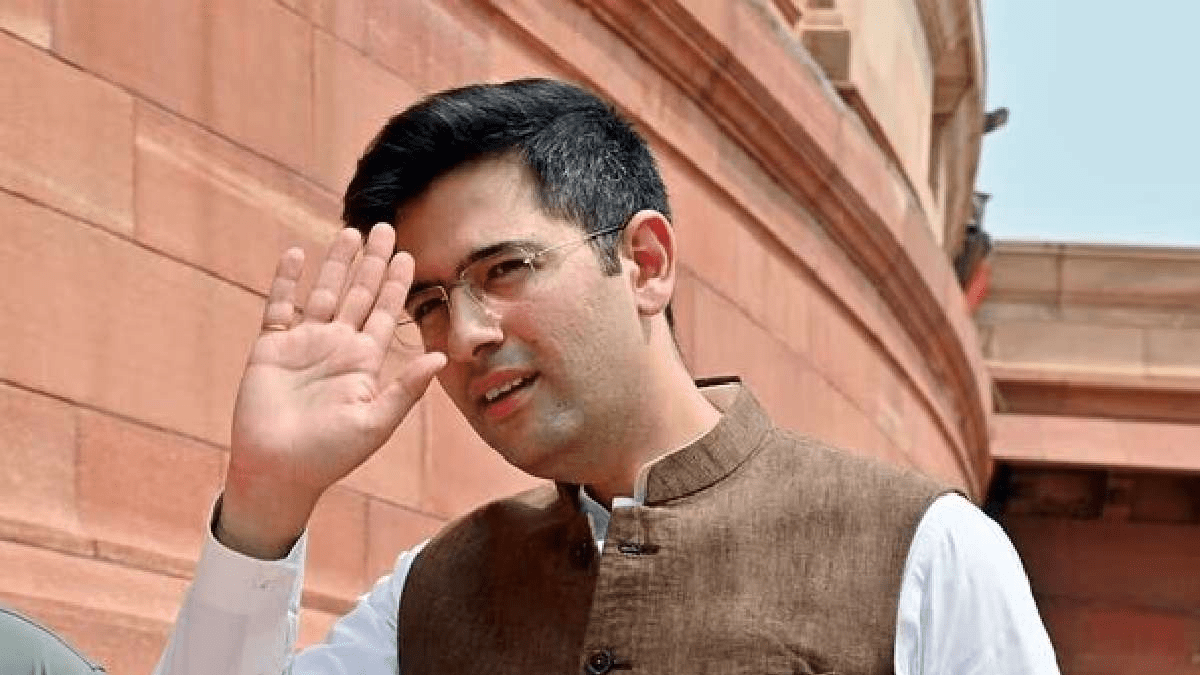 AAP MP Raghav Chadha dressed in a yellow Blinkit delivery uniform and helmet, riding pillion on a scooter with a delivery partner through city streets AAP MP Raghav Chadha dressed in a yellow Blinkit delivery uniform and helmet, riding pillion on a scooter with a delivery partner through city streets