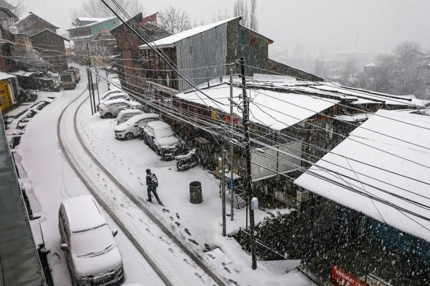 A citizen walks amid heavy snowfall at Bhaderwah, in Doda district, Jammu and Kashmir, Friday, Jan. 23, 2026. (Photo aource: PTI)
