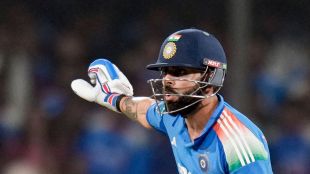 Virat Kohli looking surprised as Indore crowd chants against Gautam Gambhir during post-match presentation.