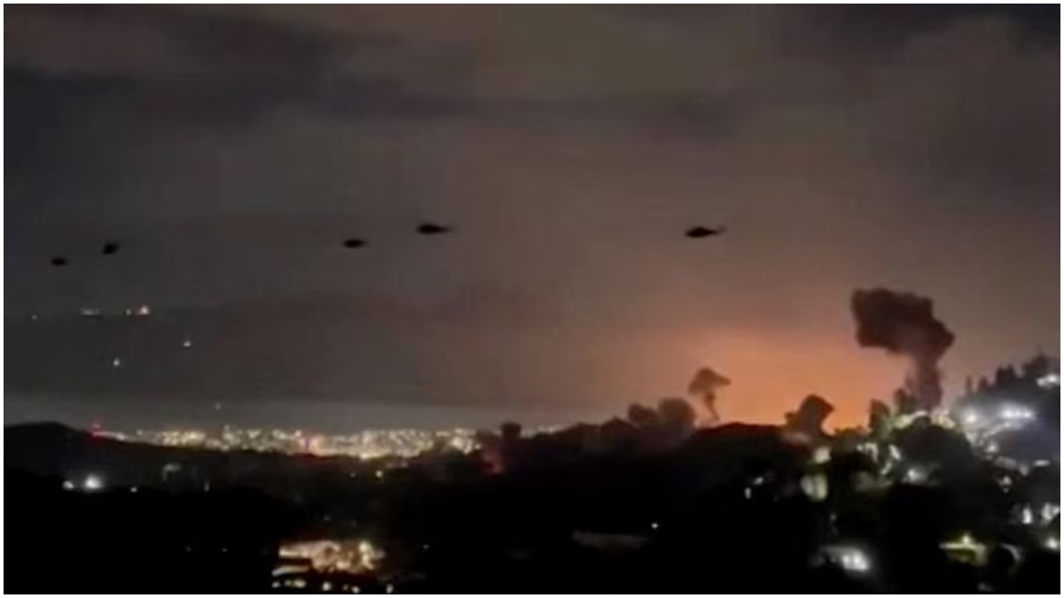 Helicopters fly past plumes of smoke rising from explosions, in Caracas, Venezuela, January 3, 2026 in this screen grab obtained from video obtained by Reuters.