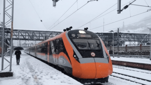 The Vande Bharat train travels through snow-laden tracks near Banihal as fresh snowfall blankets the Kashmir Valley -Watch scenic beauty