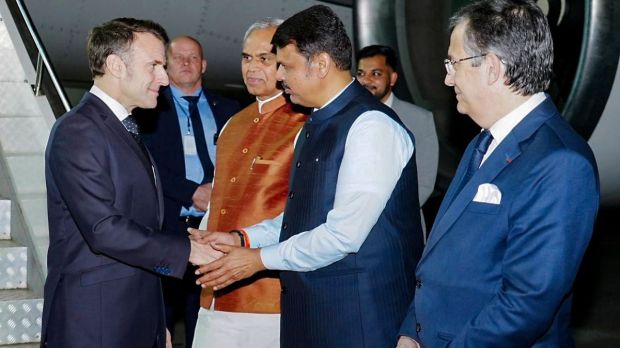 French President Emmanuel Macron and First Lady Brigitte Macron are greeted by Maharashtra Governor Acharya Devvrat and CM Devendra Fadnavis upon their late-night arrival at Chhatrapati Shivaji Maharaj International Airport. The visit underscores Mumbai's role as a primary hub for Indo-French economic cooperation. (Image Source: PTI)