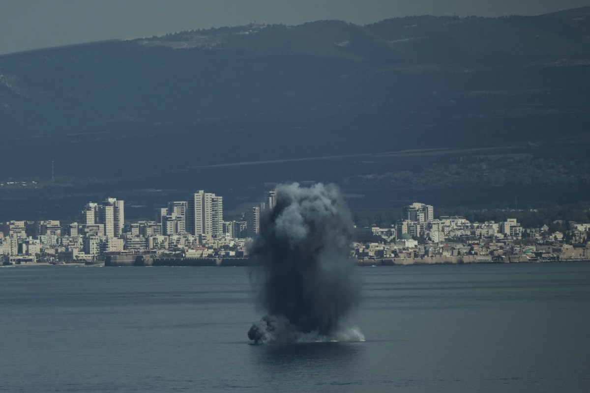 An incoming projectile explodes over the water as Israel issues a nationwide alert following its strikes on Iran, in Haifa Bay (Photo: AP) An incoming projectile explodes over the water as Israel issues a nationwide alert following its strikes on Iran, in Haifa Bay (Photo: AP)