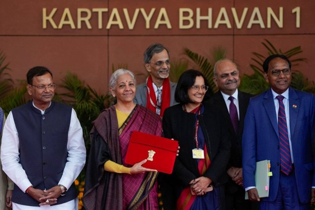 FM Nirmala Sitharaman poses with her team before heading to present the Union Budget in New Delhi.  (Photo source: PTI)