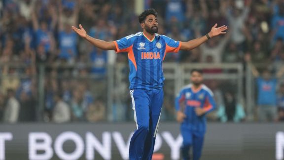 Mohammed Siraj celebrating a wicket for India against USA at Wankhede Stadium, marking his first T20I appearance in 557 days