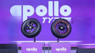 A high-tech tyre manufacturing line showing truck and passenger car radial tyres at an Apollo Tyres factory.