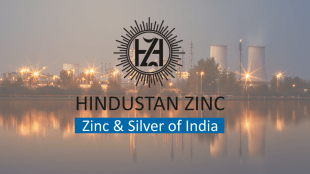 A real-time financial chart showing the sharp 14% intraday decline and subsequent recovery of international silver prices above $70, with an overlay of the Hindustan Zinc logo and its FY30 production goal of 1,500 TPA.