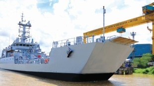 A high-speed naval warship manufactured by Garden Reach Shipbuilders sailing through deep blue waters during a maritime exercise.
