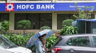 The HDFC Bank corporate headquarters with a digital overlay showing a Rs 19,221 crore net profit and the Rs 13 per share dividend announcement.