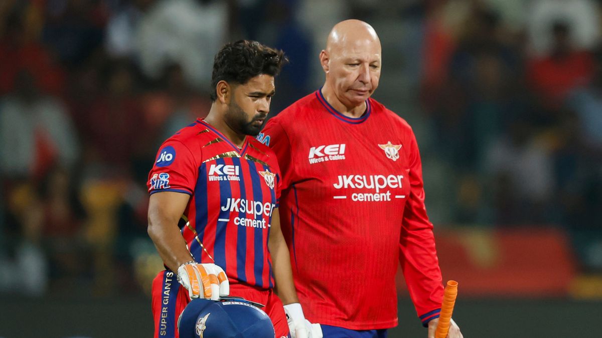 Rishabh Pant clutching his left elbow after being hit by Josh Hazlewood in LSG vs RCB IPL 2026. Rishabh Pant clutching his left elbow after being hit by Josh Hazlewood in LSG vs RCB IPL 2026.