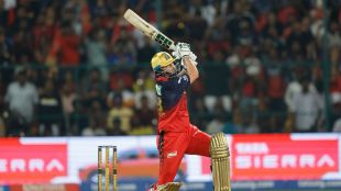 Tim David in action for RCB hitting a six against CSK to reach 250 runs in IPL 2026.