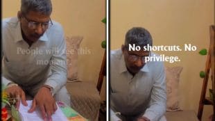 Father carefully reading his son’s Amazon offer letter aloud, showing emotional pride and curiosity in a viral social media video.