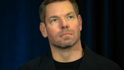 Why is Eric Swalwell facing resignation calls?