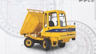 An industrial Ajax self-loading concrete mixer processing raw material on a large highway infrastructure construction site in India.