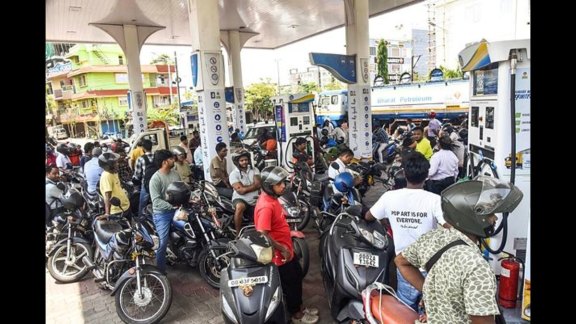 A large crowd of people on two-wheelers queues up at a Bharat Petroleum pump amid fuel shortage and price hike concerns in Bhubaneswar on Friday.
