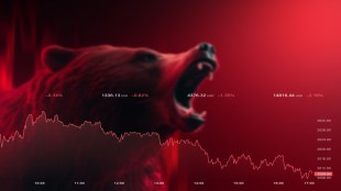 A large red digital trading board at the National Stock Exchange displaying a deep percentage drop in the Nifty IT and Nifty Metal indices, with a downward sloping red trendline indicating a sudden afternoon market sell-off.