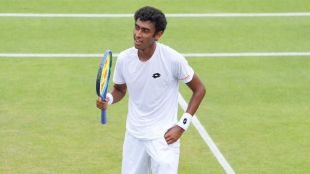 Arnav Paparkar of India during 2026 Wimbledon Boys' quarterfinal match