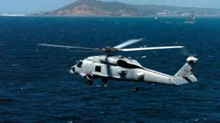 US Navy helicopter make an emergency landing