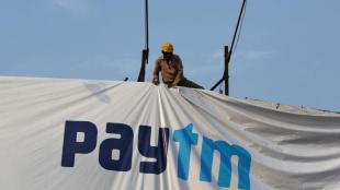 Paytm financial scorecard showing Q1 FY27 consolidated net profit surging 79 percent year-on-year to Rs 220 crore alongside revenue from operations reaching Rs 2,448 crore.