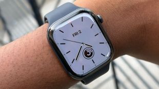 The polished ceramic Apple Watch Series 12 paired with a navy blue Sport Band offers a premium look on the wrist.