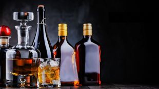 The domestic alcoholic beverages market was estimated at Rs 6.2 lakh crore in calendar year 2025, equivalent to 1.8% of nominal GDP, the report said. (Image/Canva)